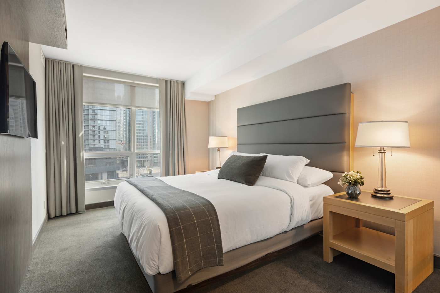 Moody luxury suite interior with dramatic low lighting and textured walls